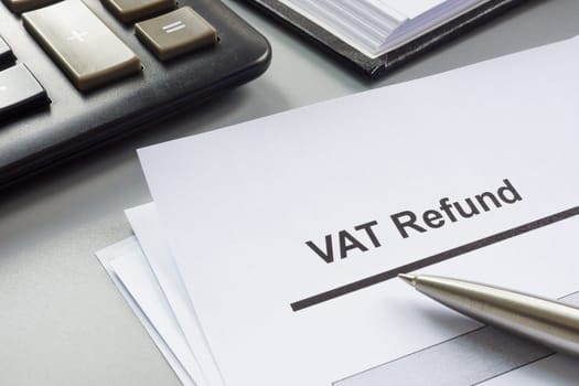 VAT refund form to fill out and a calculator.