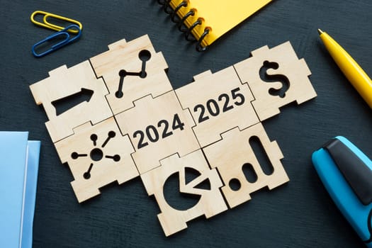 Pieces of a puzzle with elements of financial plan or KPI for 2024 and 2025.