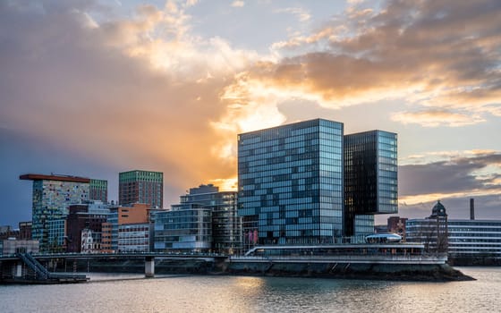 DUSSELDORF, GERMANY - MARCH 25, 2023: Panoramic image of modern buildings in the media harbor of Dusseldorf on March 25, 2023 in Germany, Europe