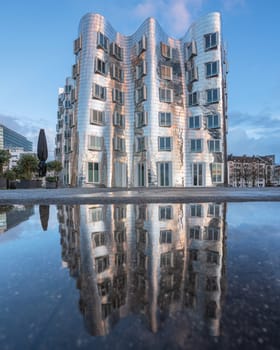 DUSSELDORF, GERMANY - MARCH 25, 2023: Panoramic image of modern buildings in the media harbor of Dusseldorf on March 25, 2023 in Germany, Europe