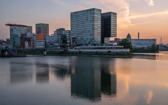 DUSSELDORF, GERMANY - MAY 25, 2023: Panoramic image of modern buildings in the media harbor of Dusseldorf on May 25, 2023 in Germany, Europe