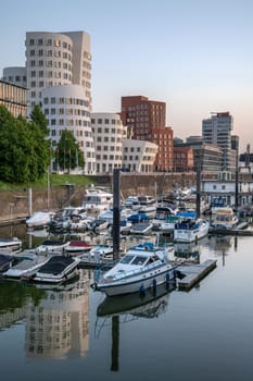 DUSSELDORF, GERMANY - MAY 25, 2023: Panoramic image of modern buildings in the media harbor of Dusseldorf on May 25, 2023 in Germany, Europe