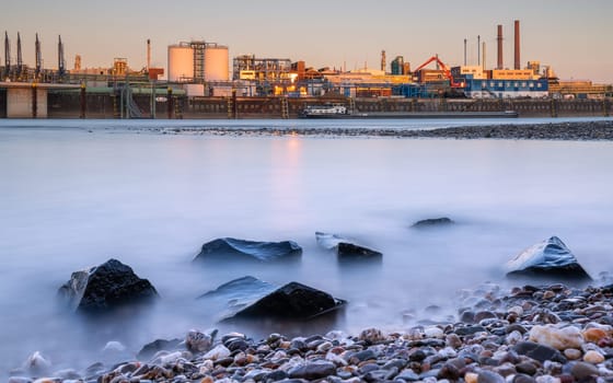 LEVERKUSEN, GERMANY - MARCH 1, 2023: Industrial area of Chempark Leverkusen close to Rhine River during Sunset on March 1, 2023 in North Rhine Westphalia, Germany