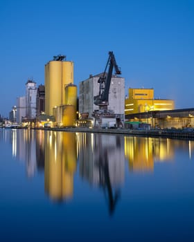 HAMM, GERMANY - FEBRUARY 28, 2023: Port of Hamm during blue hour with water reflection on February 28, 2023 in Germany