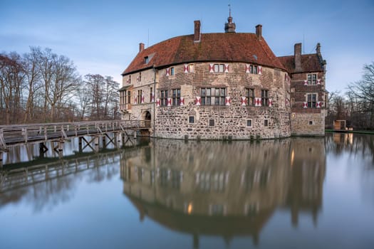 LUEDINGHAUSEN, GERMANY - JANUARY 7, 2023: Vischering castle in evening light on January 7, 2023 in Luedinghausen, Germany