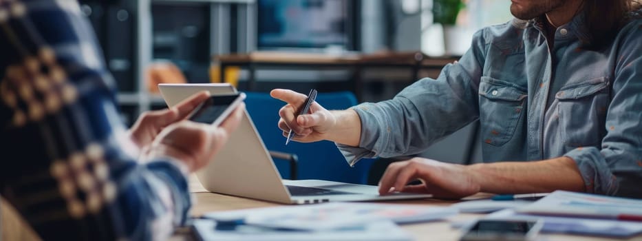 Two people are sitting at a table with a laptop and a pen by AI generated image.