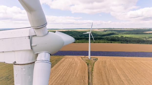 Aerial drone shot Wind Turbine blade producing alternative gren energy. Green deal and zero carbon footprint