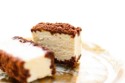 Sweet food, restaurant and luxury gourmet gastronomy concept - Classic cheesecake with chocolate on a golden plate, european cuisine dessert