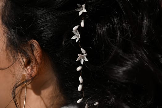 Brunette bride with a white lilies in her hair Hairstyle
