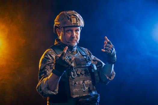 A portrait showcases a soldier in tactical gear against a backdrop of intense orange and blue smoke effects