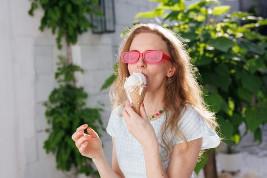 girl eats ice cream balls in hot summer, escape from the girl in pink glasses eats ice cream balls in the hot summer, escape from the heat