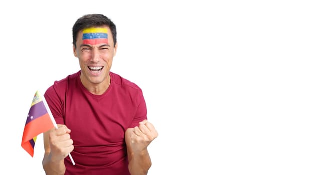Man passionately cheering for Venezuela screaming and waving a national flag