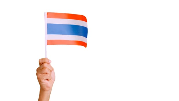 Photo of wind waving a thai pennant holding by a hand