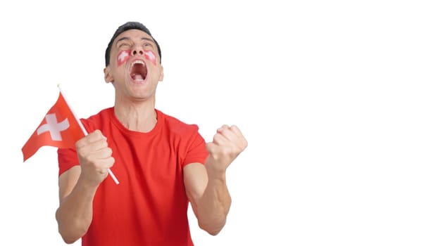 Man passionately cheering for Switzerland screaming and waving a national flag