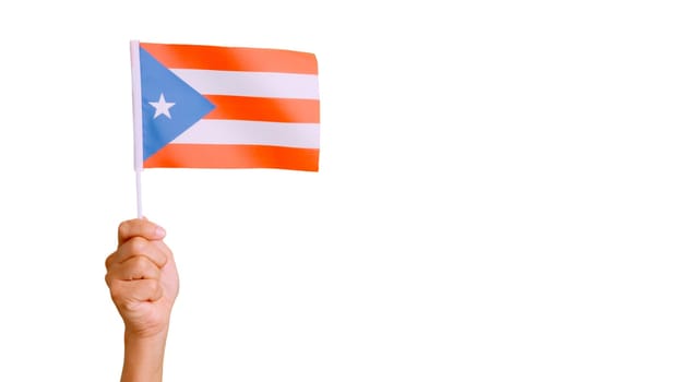 Photo of wind waving a puerto rican pennant holding by a hand.