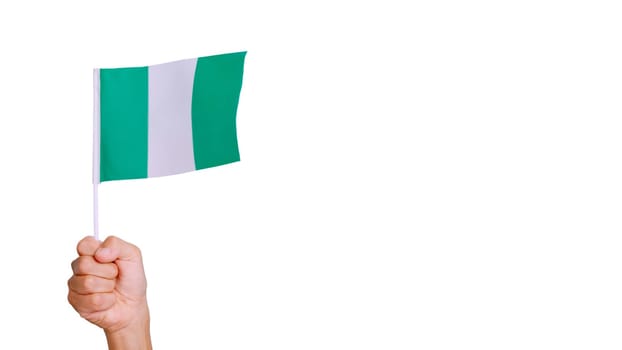 Photo of wind waving a nigerian pennant holding by a hand. Slow Motion video