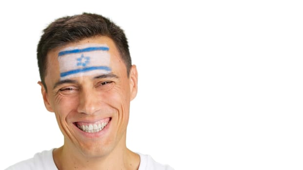 Close up of a man with a israeli flag painted on the face smiling at camera