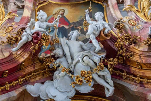 OTTOBEUREN, BAVARIA, GERMANY, JUNE 04, 2022 : Rococo stuccowork statues, by various anonymous artists, 18th century,  in  Ottobeuren abbey basilica