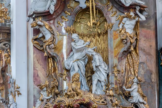 OTTOBEUREN, BAVARIA, GERMANY, JUNE 04, 2022 : Rococo stuccowork statues, by various anonymous artists, 18th century,  in  Ottobeuren abbey basilica