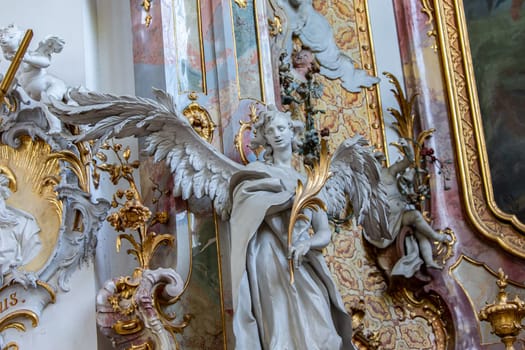 OTTOBEUREN, BAVARIA, GERMANY, JUNE 04, 2022 : Rococo stuccowork statues, by various anonymous artists, 18th century,  in  Ottobeuren abbey basilica