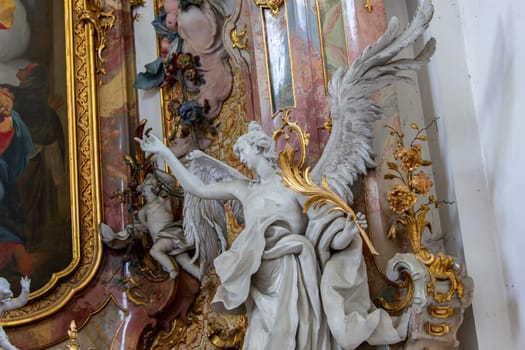 OTTOBEUREN, BAVARIA, GERMANY, JUNE 04, 2022 : Rococo stuccowork statues, by various anonymous artists, 18th century,  in  Ottobeuren abbey basilica