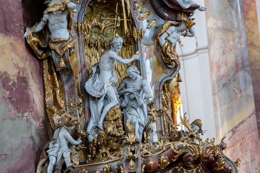 OTTOBEUREN, BAVARIA, GERMANY, JUNE 04, 2022 : Rococo stuccowork statues, by various anonymous artists, 18th century,  in  Ottobeuren abbey basilica