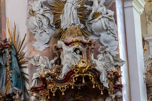 OTTOBEUREN, BAVARIA, GERMANY, JUNE 04, 2022 : Rococo stuccowork statues, by various anonymous artists, 18th century,  in  Ottobeuren abbey basilica