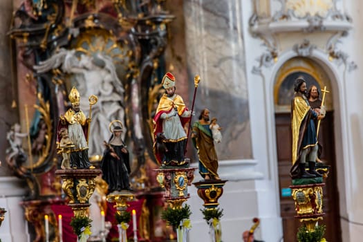 OTTOBEUREN, BAVARIA, GERMANY, JUNE 04, 2022 : Rococo stuccowork statues, by various anonymous artists, 18th century,  in  Ottobeuren abbey basilica