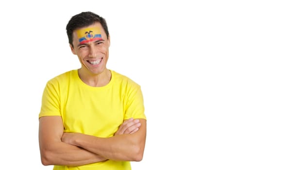 Man standing with ecuadorian flag painted on face smiling with arms crossed