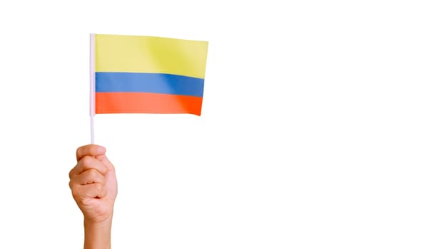 Photo of wind waving a colombian pennant holding by a hand. Slow Motion video