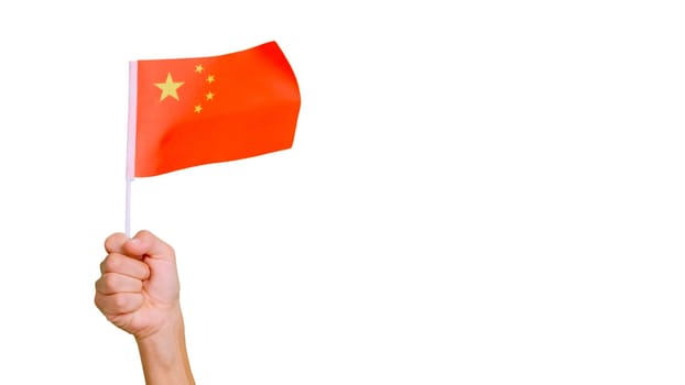 Photo of wind waving a chinese pennant holding by a hand