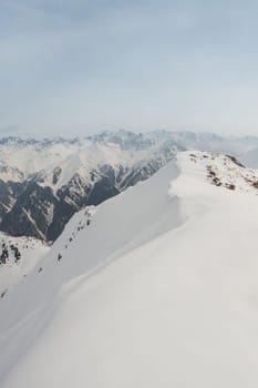 View of winter Tien Shan mountain ranges from Bukreev Peak in the mountains of Central Asia, Kazakhstan - Almaty.