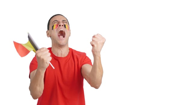 Man passionately cheering for Belgium screaming and waving a national flag
