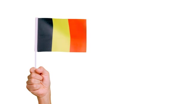 Photo of wind waving a belgian pennant holding by a hand.