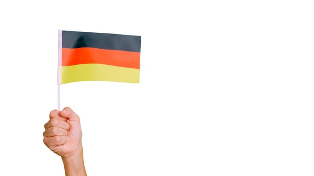Photo of wind waving a german pennant holding by a hand