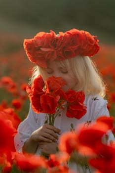 A young girl is standing in a field of red flowers, holding a bouquet of red flowers