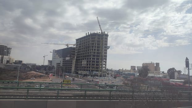 construction of a new residential and office building along the railway, city, transport. High quality photo