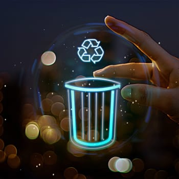 Finger over a holographic logo of trash bin and recycle symbol. Concept of technology for environment protection.