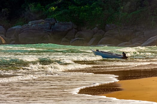 Speedboat on the waves of Bonete beach on Ilhabela island in Sao Paulo