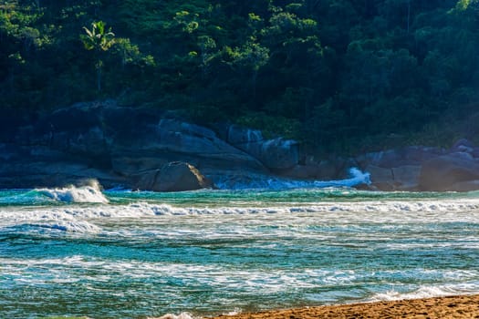 The sea and the waves in front of the rocks of Bonete beach on the island of Ilhabela