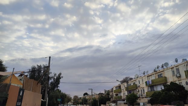 view of the city and buildings from the window, landscape sky clouds. High quality photo