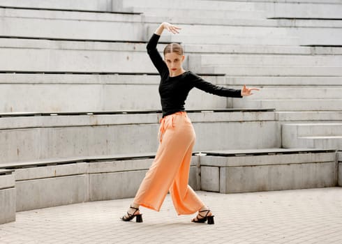 Sweet Girl Dances In Sandals At Amphitheater In Summer