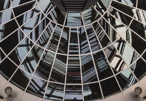 Berlin, Germany - Dec 20, 2023 - Architecture interior of the Cupola of the Reichstag dome is a glass dome constructed on top of the rebuilt Reichstag building. a major tourist attraction of the berlin city, Space for text, Selective focus.