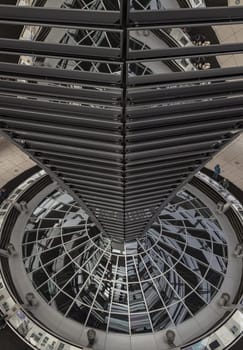 Berlin, Germany - Dec 20, 2023 - Architecture interior of the Cupola of the Reichstag dome is a glass dome constructed on top of the rebuilt Reichstag building. a major tourist attraction of the berlin city, Copy space, Selective focus.