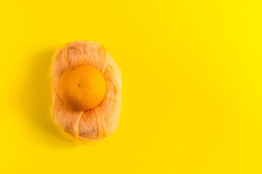 Oranges and tangerines on a yellow background. Fresh healthy food. Chinese New Year