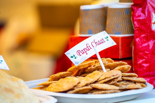 Papdi chaat a popular indian street food snack with the food and a name tag showing this crunchy snack in India