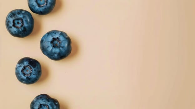 Blueberries on beige background, top view.