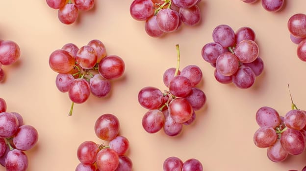 Red grapes on pastel background, top view. Fresh fruit pattern concept.