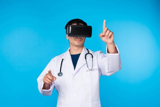 Smart doctor wearing VR headset connecting metaverse choosing analytical medicine research isolated blue background futuristic technology hologram virtual reality intelligent meta world. Contrivance.