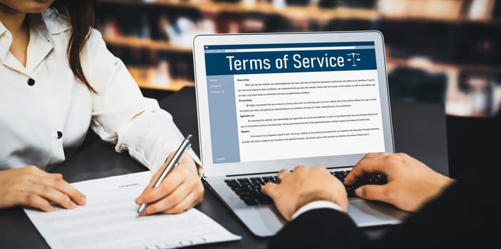 Online term of service conditions showing savvy rules and regulations in using the website on a laptop computer screen for users to make an agreement